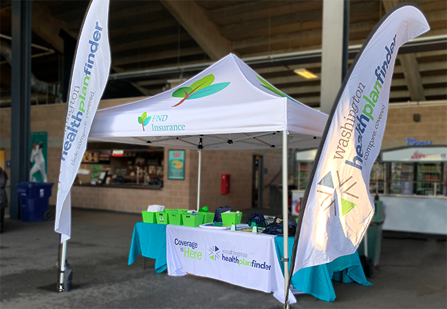 Washington Healthplanfinder and FND-branded display at a community event