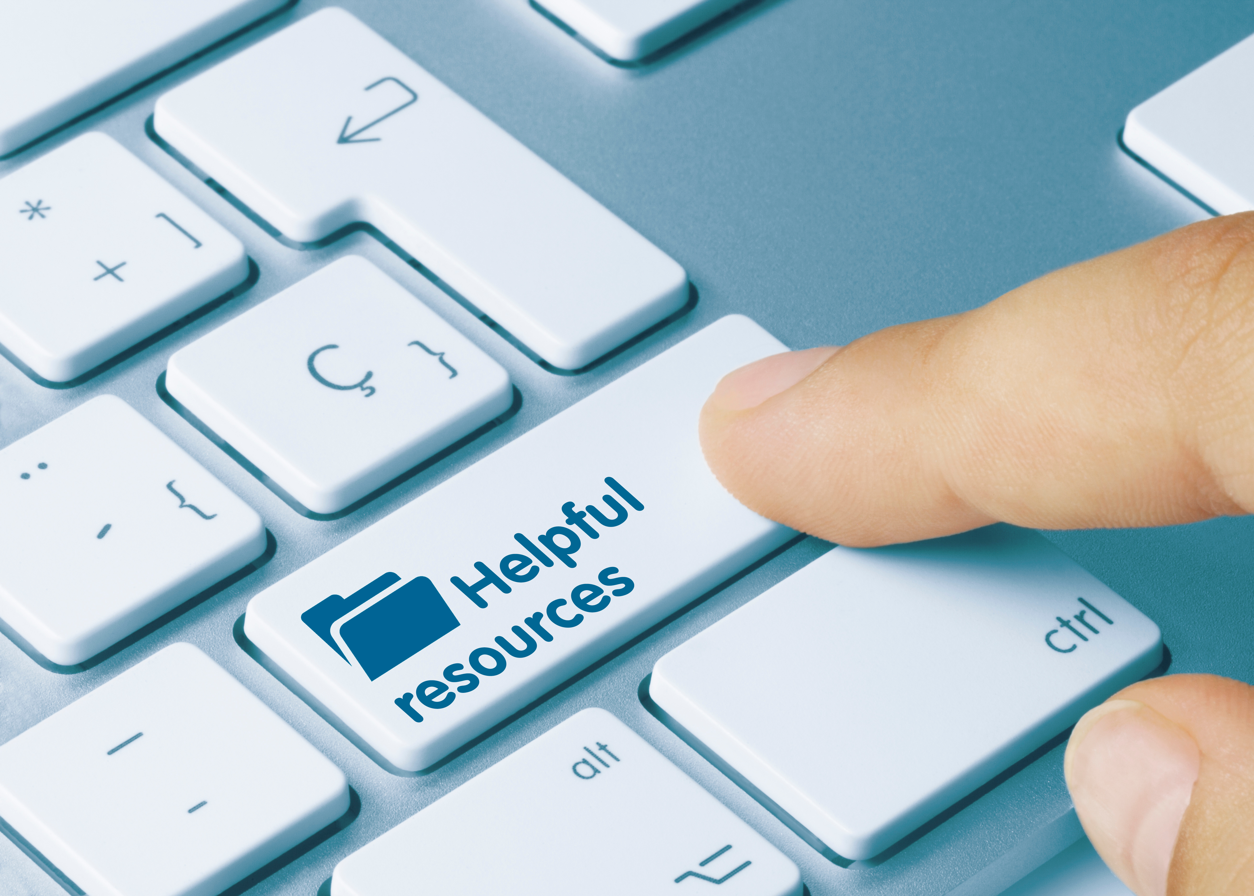 Index finger hitting a kebyoard button renamed "Helpful resources"